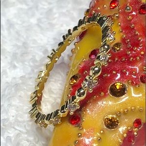 Dainty gold tone ring -wedding band style with diamonds